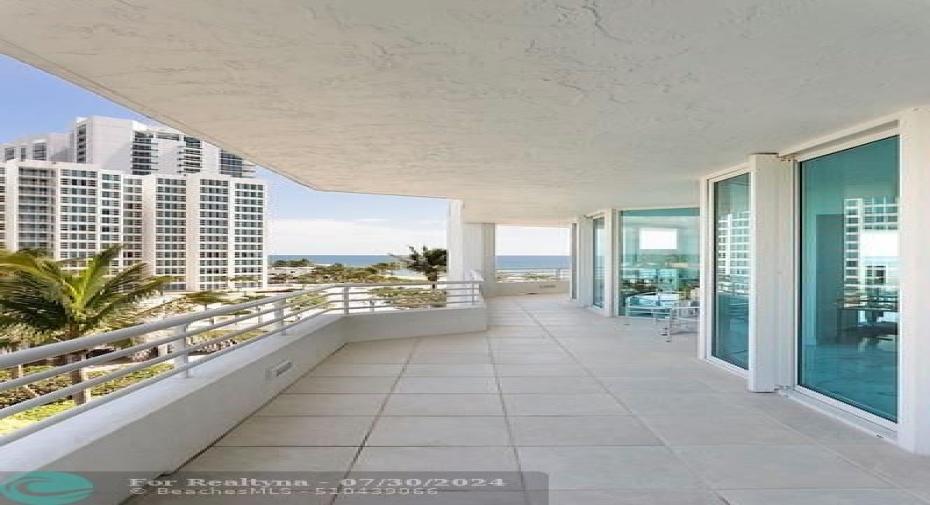 Balcony along Kitchen and Bedrooms