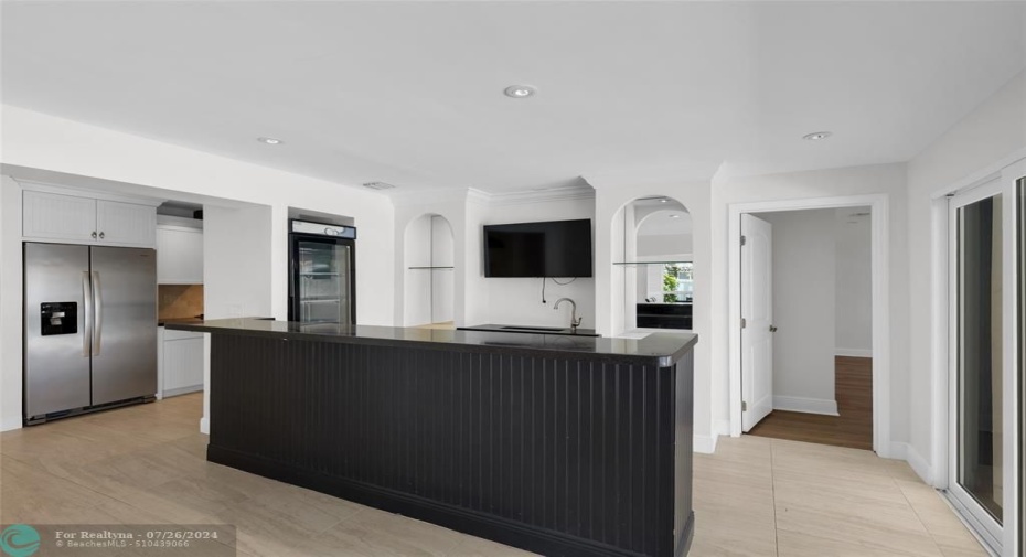 Enjoy this wet bar located next to dining room and kitchen and is the perfect space to entertain guests