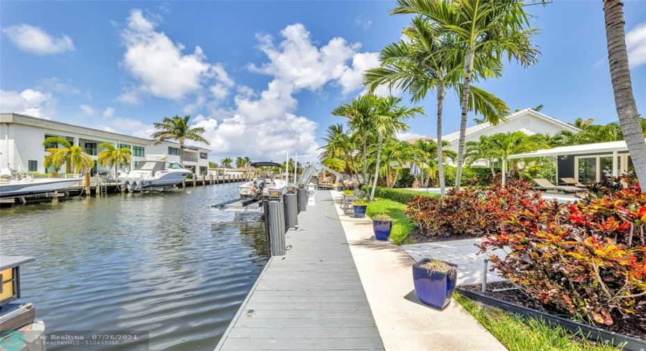 Seawall and Dock featured in backyard is just waiting to host your boat