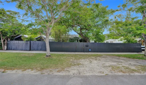 Step behind the gate to your waterfront tropical oasis!