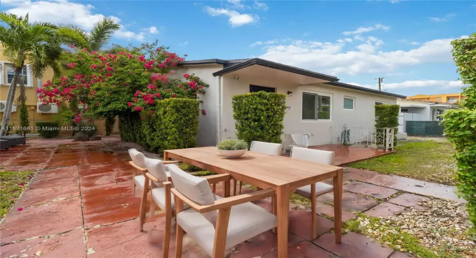 Spacious gardens welcomes you to this cozy home. Enjoy the outdoors in the spacious yard surrounded by beautiful palm trees and privacy shrubs.