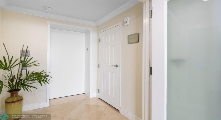 Elevator access into a private foyer.