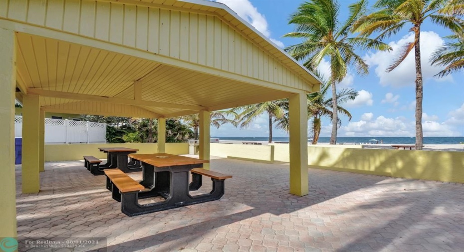 Private Beach Shelters with barbecue and tables