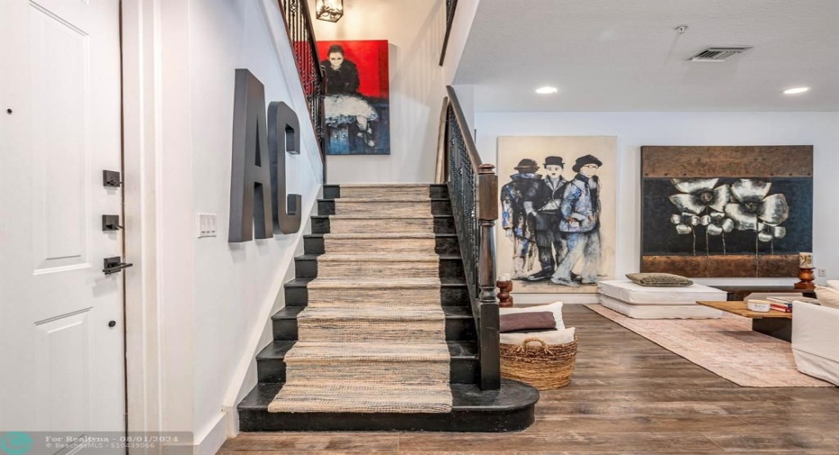 Stairs and back door to garage.