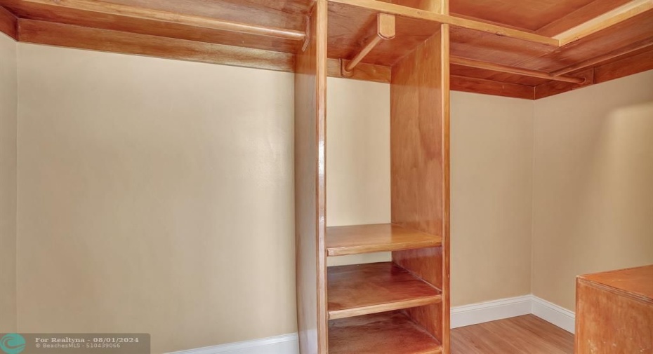 Walk in Closet with custom shelving in Primary closet