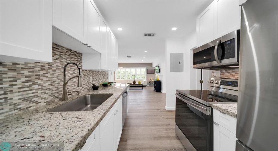 Enjoy Your UPDATED Kitchen with Tall Custom Cabinetry, Granite Counters & Samsung Stainless Steel Appliances. 2023-RENOVATED Kitchen, Both Bathrooms & Dimmable LED Lighting throughout.