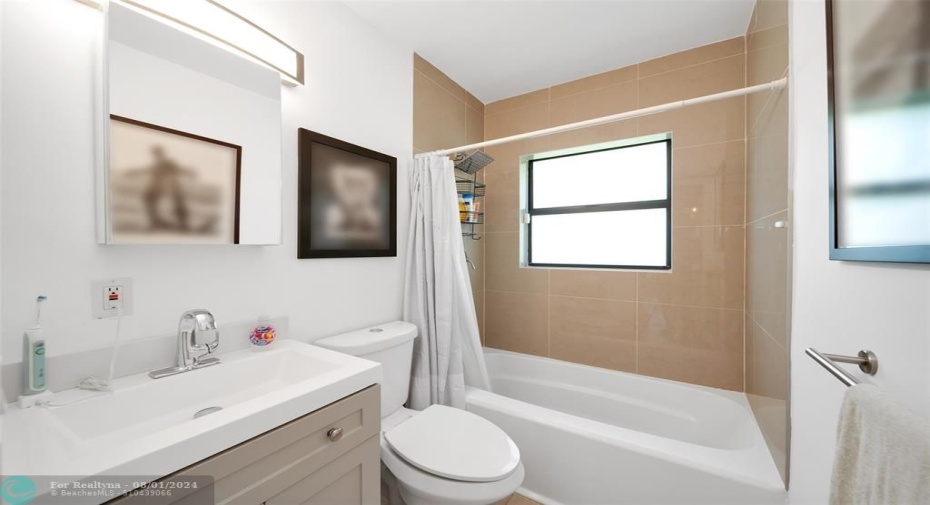 2023 Updated Guest Bathroom with Ceramic Tile Floors & Tub & Shower Combination.