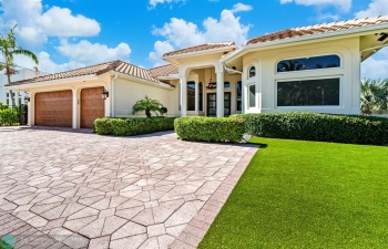 Front exterior with astroturf.