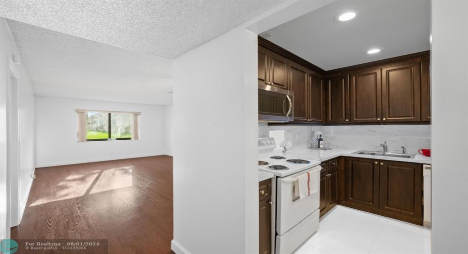 White polished porcelain flooring in kitchen.