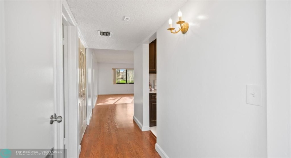 Wood flooring flows throughout the freshly painted interior.