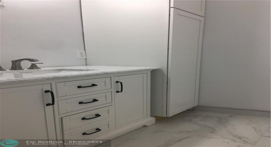 Bathroom with utility cabinet
