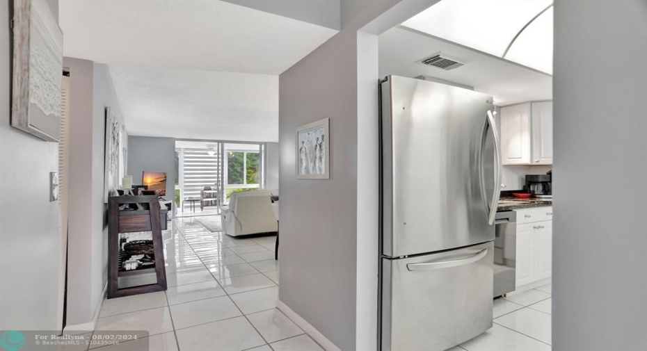 FOYER TO KITCHEN AND LIVINGROOM