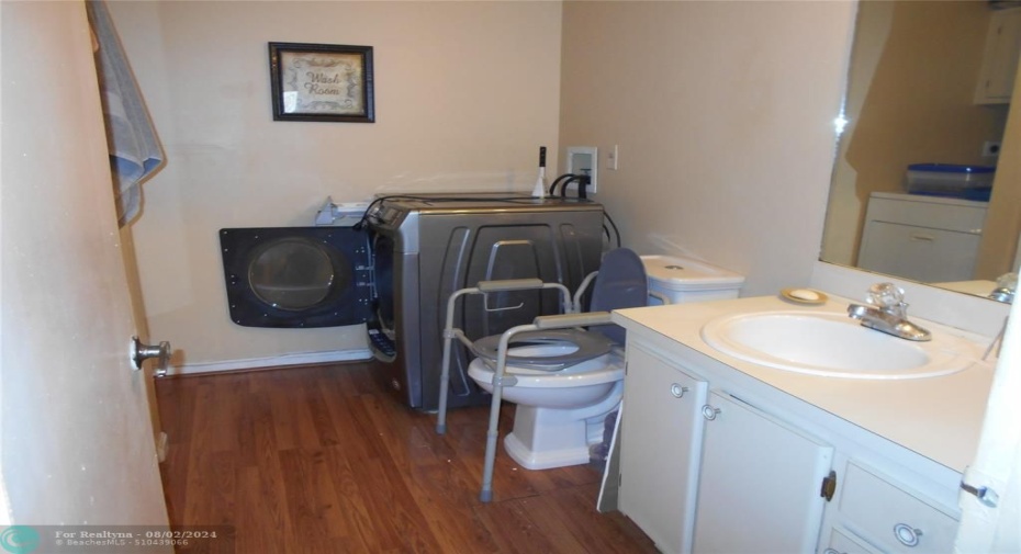 1/2 Bath on 1st floor also doubles as the laundry room with a full size washer and dryer