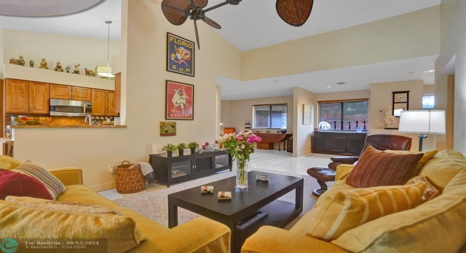 living room area with view of kitchen