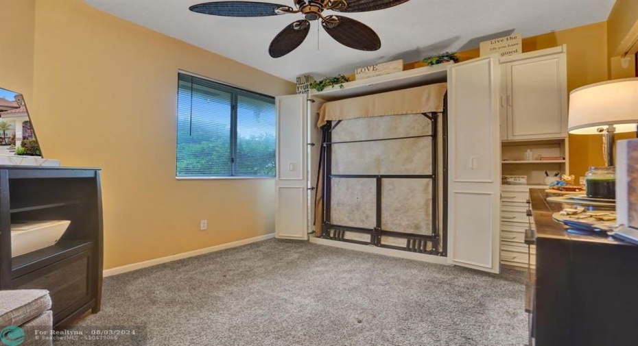 2nd bedroom with walk in closet and built in murphy bed.