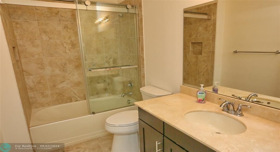 Guest bathroom with glass shower doors