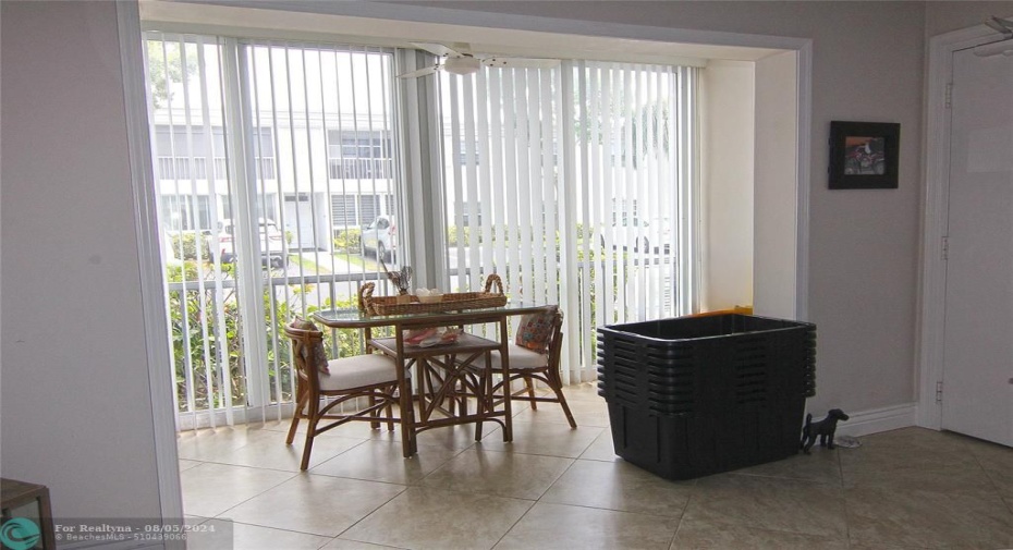 Enclosed porch for extra living space -all impact glass