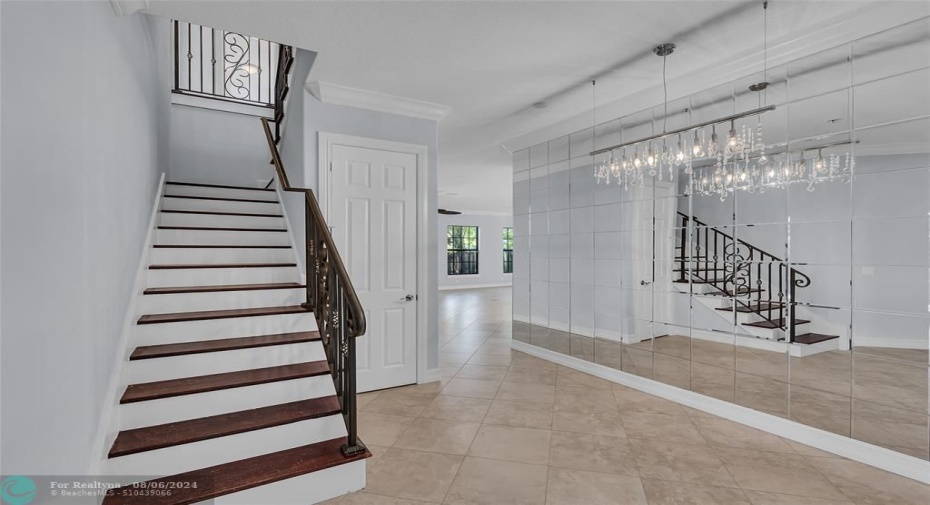 Front entrance and staircase to second floor and 4 bedrooms and bathrooms