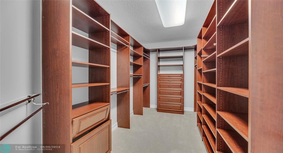 Walk in closet #1 of the huge master bedroom closets