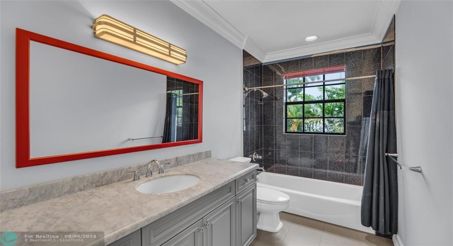 Bathroom 2 with tub/shower combo and marble vanity