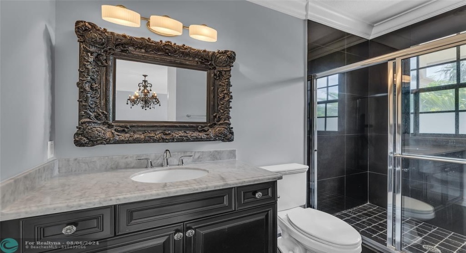 Bathroom 4 with black marble vanity and walk in shower