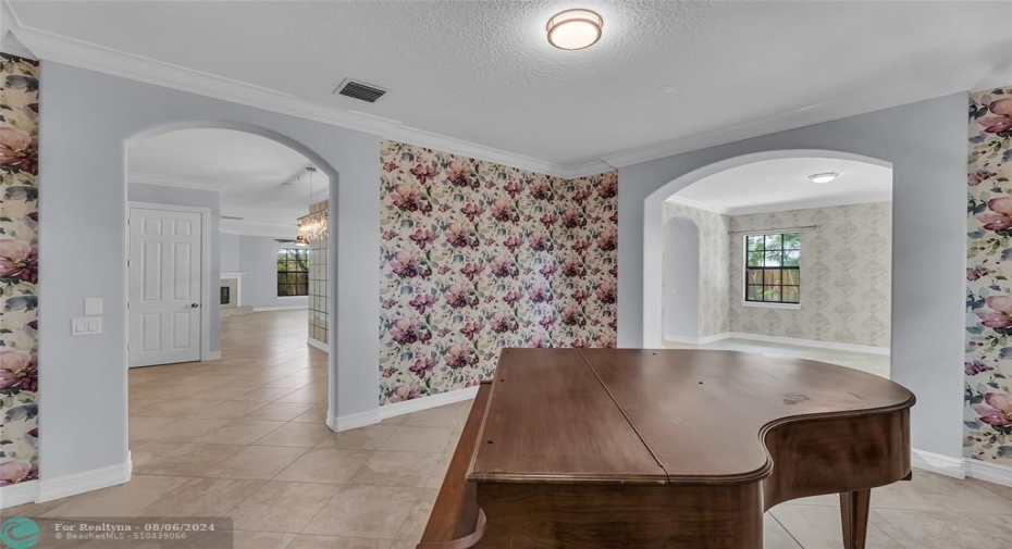 Formal Dining room with crown molding and entrance into Dining Room