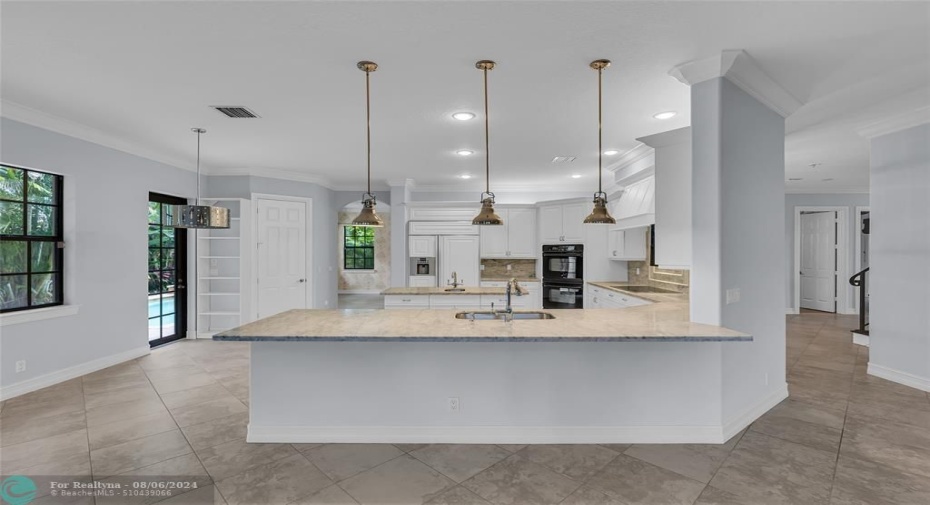 Large breakfast bar is shared with family room and the perfect space for entertaining