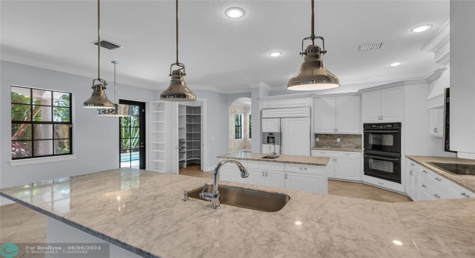 Great Carrera marble counterspace and large open kitchen for entertaining