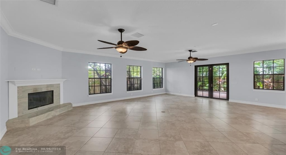 An abundance of natural light offered in family room and kitchen with French doors out to backyard