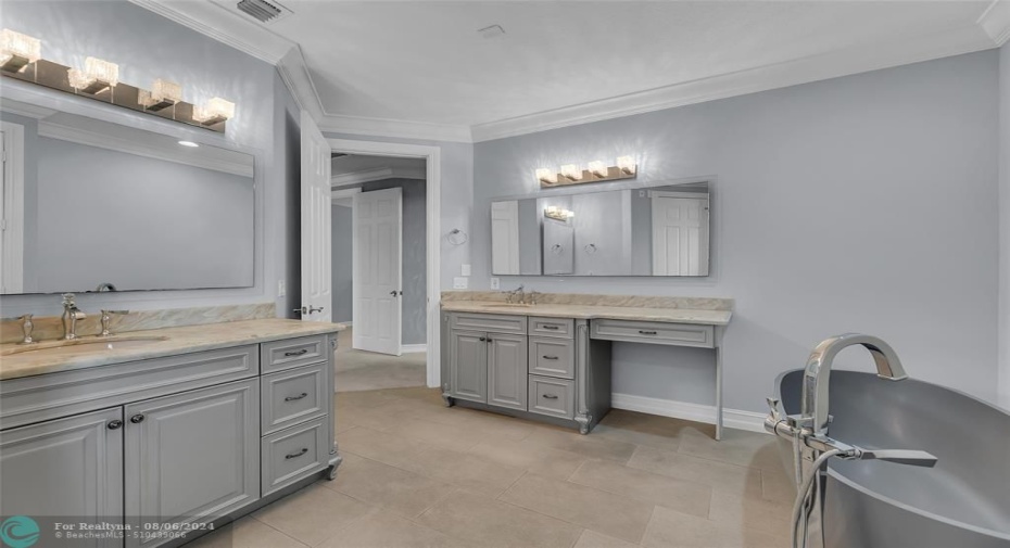 Double Marble vanities with great storage and stand alone tub