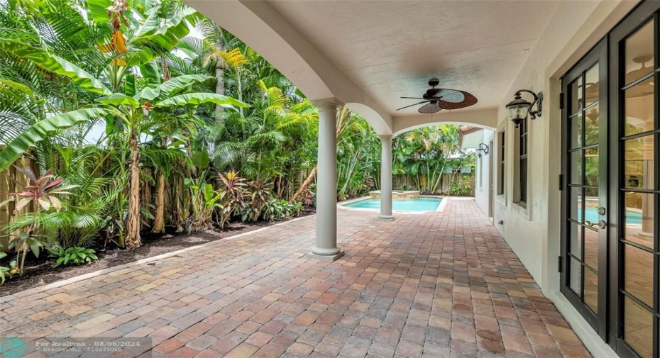 Huge covered back patio is the perfect retreat from the dun