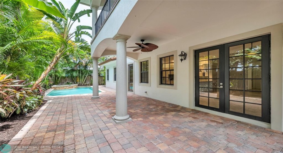 27foot long covered pavered patio from family room and kitchen