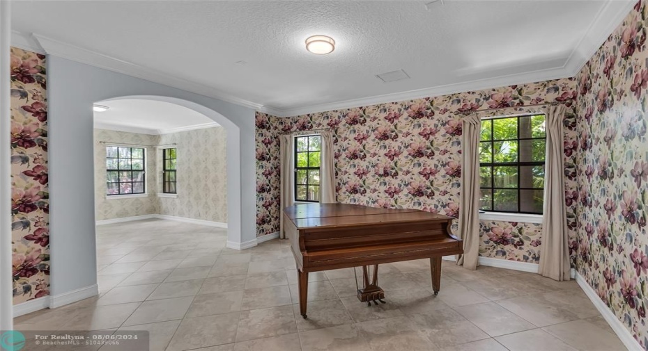 Formal Living room with crown molding and great light