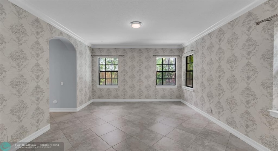 Dining room features an abundance of natural lights with entrance into kitchen