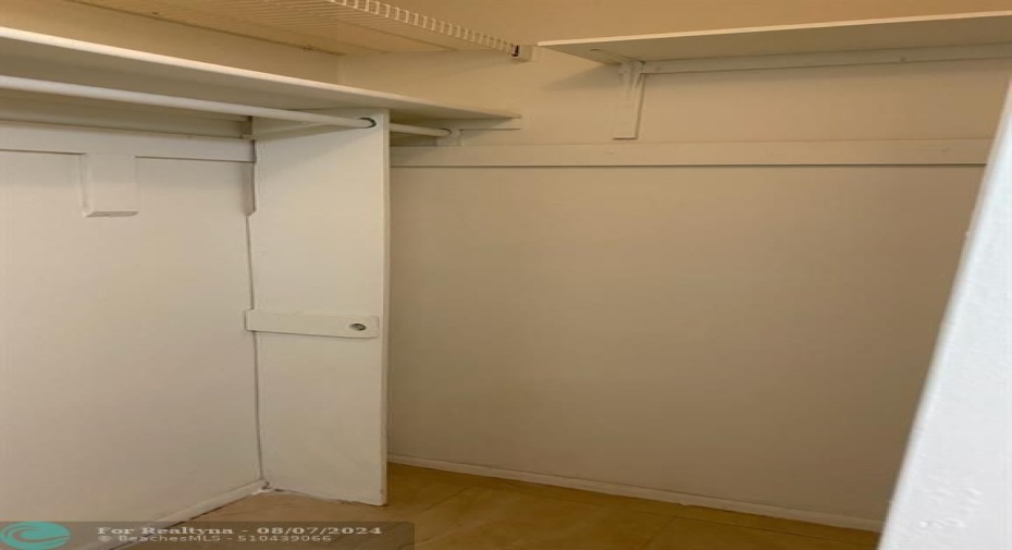 ONE OF TWO LARGE WALK-IN CLOSET FOR MASTER BEDROOM