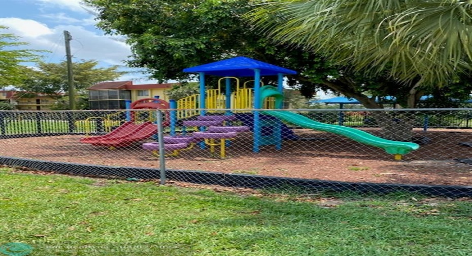 VERY NICE FENCED IN PLAY AREA FOR CHILDREN - NEXT TO SCREENED POOL