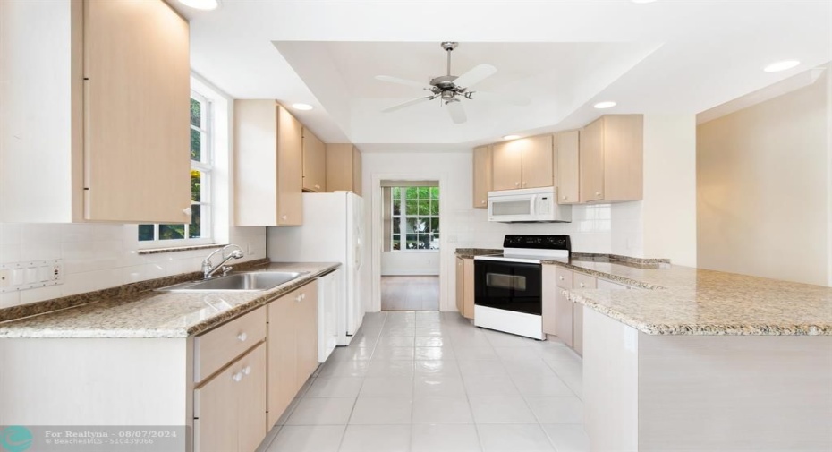 A SET OF STAINLESS APPLIANCES AND THIS KITCHEN WILL BE COMPLETE