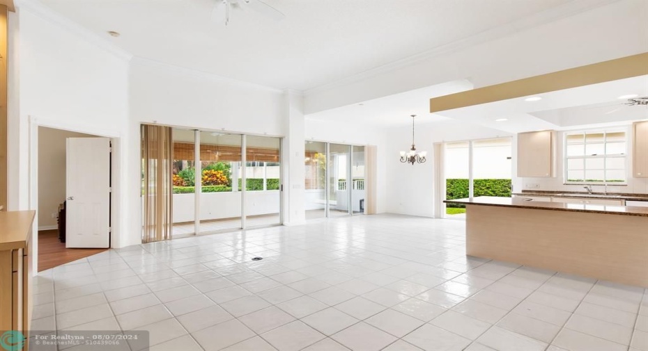 OPEN FLOOR PLAN WITH SOARING CEILINGS AND NEWER NEUTRAL WHITE TILE