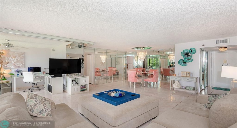 OVER 1400 SQ FEET.. WONDERFUL LUCITE FANS WHICH ARE ALMOST INIVISABLE, CRYSTAL LIGHTS IN HALLWAYS BEAUTIFUL CHANDLIER, BELVED MIRRORS TILE FLOORS THROUGHOUT