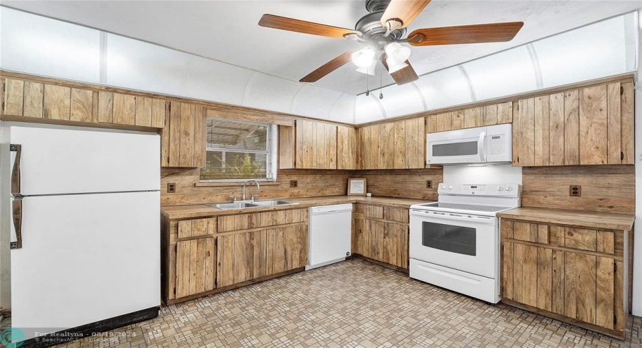 Oversized kitchen with plenty of space for an eat in dining table.