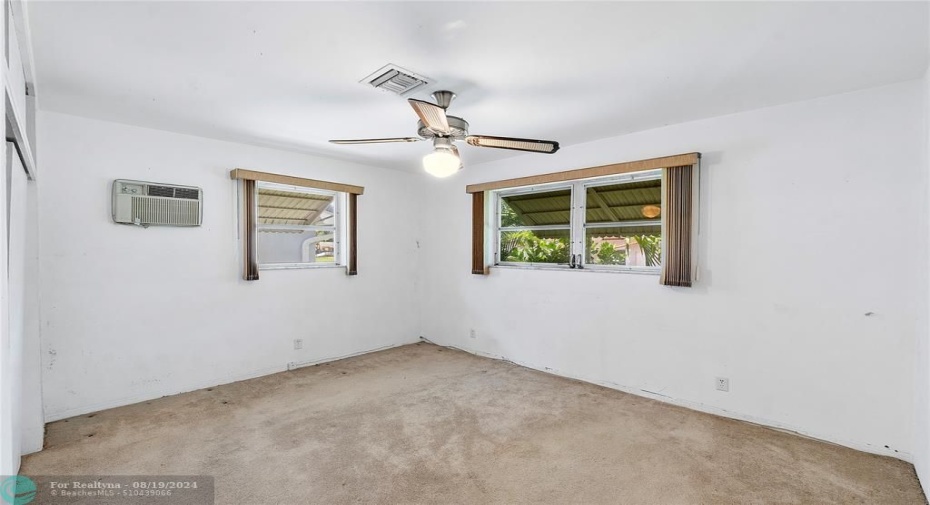 Very large bedroom with large closts and lots of natural lighting.