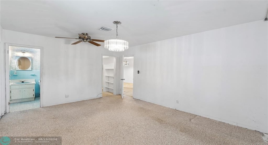 Primary bedroom en suite with big walk in closets.