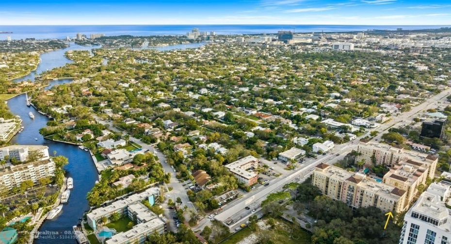 Walking area surrounding condo.  Yellow arrow on right side of photo points to unit facing north looking towards New River.