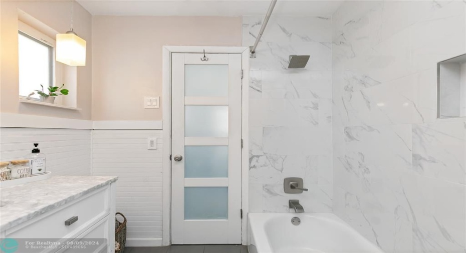 Primary bathroom with shower & bathtub