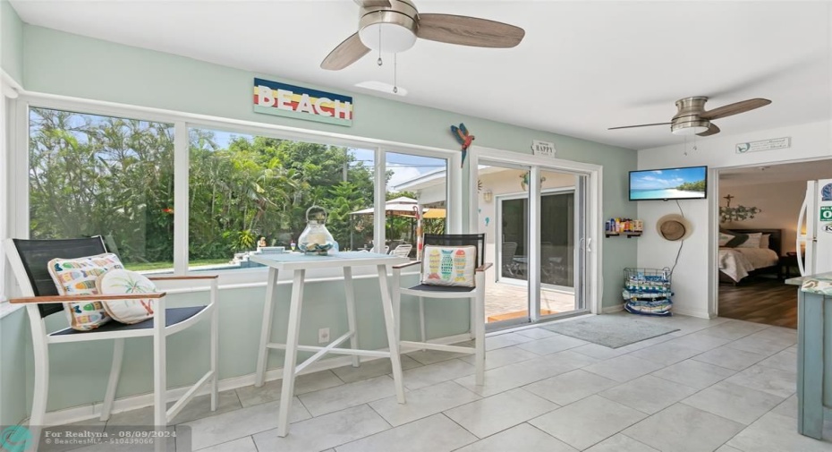 Impact enclosed breezeway area with sliders out to pool deck