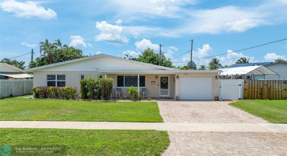 Home front facade with paved driveway and 1 car garage