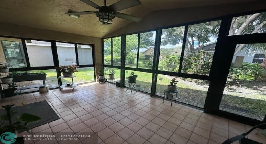 Enclosed patio with impact windows and door for extra space that can be use as a den