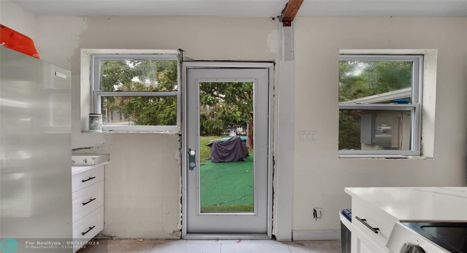 Kitchen opens to the large back yard.