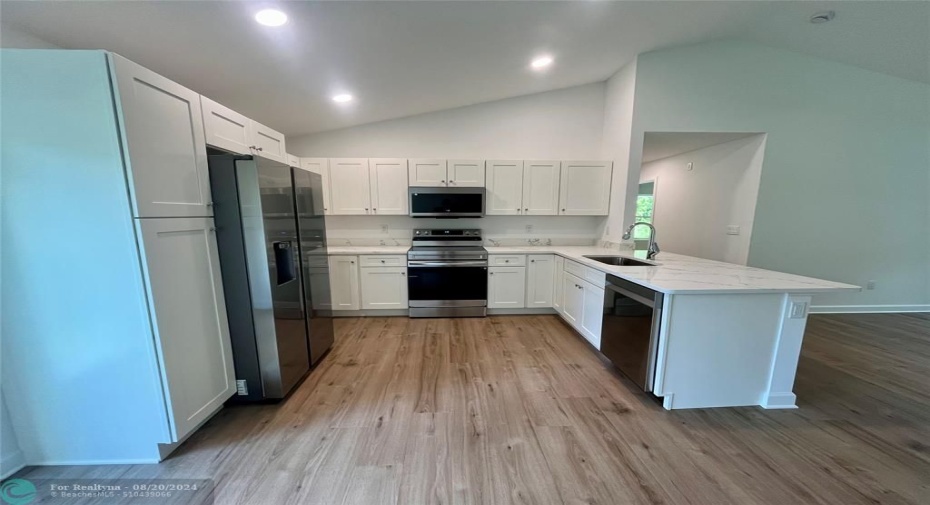 Spacious kitchen with plenty of storage.