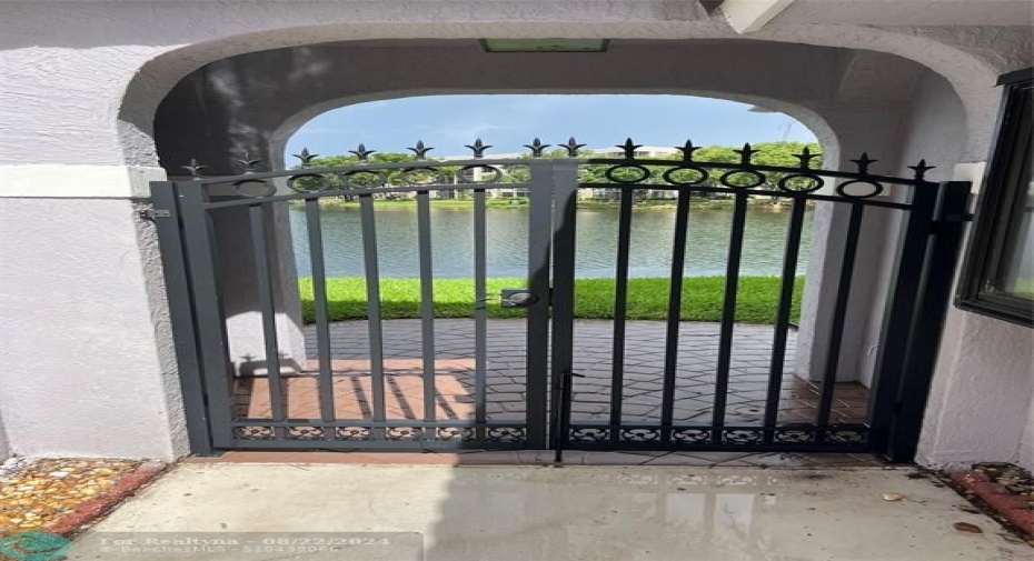 BACK COURTYARD GATE TO LAKE